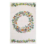 An off-white rectangular textile featuring a large central Christmas wreath design with green holly leaves, red berries, pinecones, and small orange birds, plus matching holly garland borders at the top and bottom.
