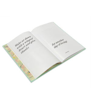 Open "Every Day is a Gift" special edition book on a while background.