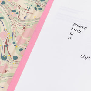 Open "Every Day is a Gift" special edition hardback book showing the marbled interior cover.