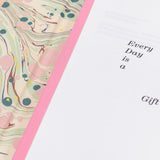 Open "Every Day is a Gift" special edition hardback book showing the marbled interior cover.